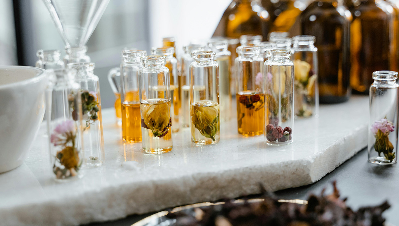 small test tubes with plants and flowers for scenting
