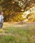A girl walking her dog within April botanical fields